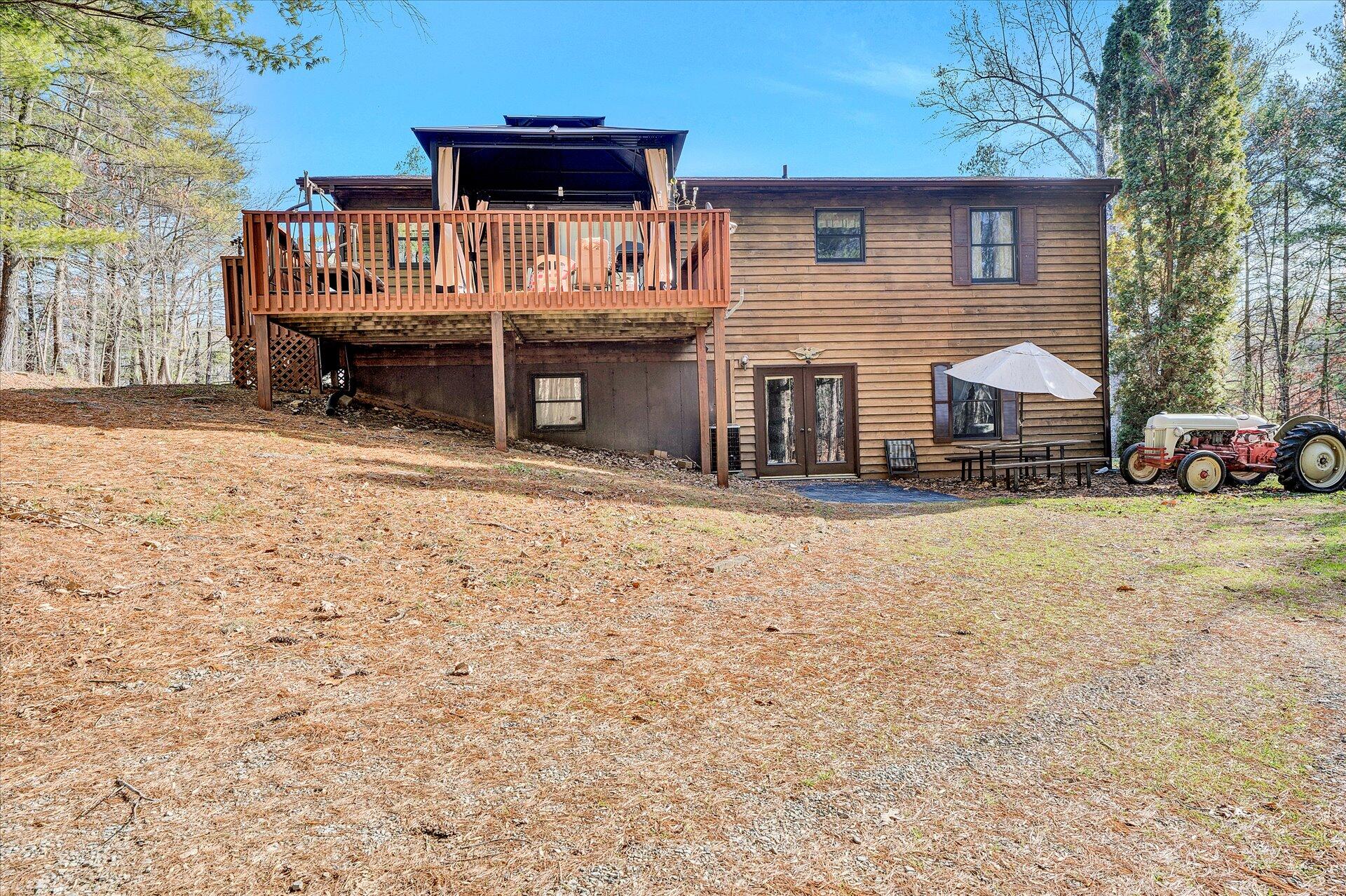 98 Sunset Ridge Road Callaway, VA 24067 - Photo 27 of 32 a front view of a house with a yard covered with snow
