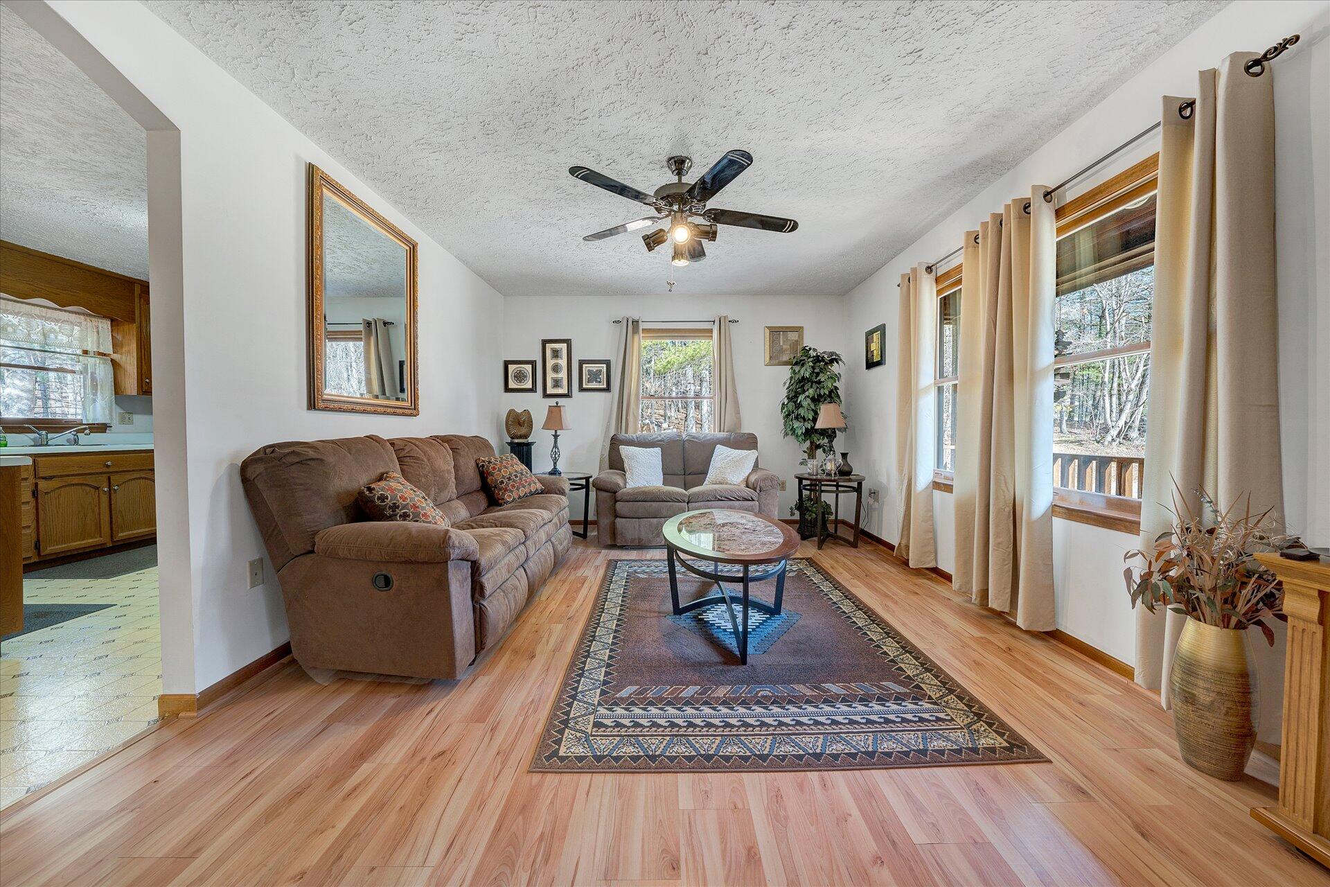 98 Sunset Ridge Road Callaway, VA 24067 - Photo 5 of 32 a living room with furniture a rug and a table