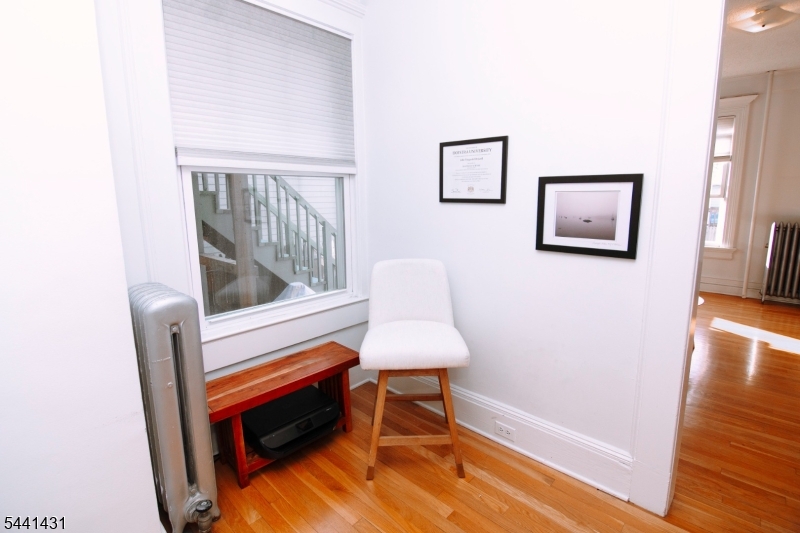 306 Springfield Avenue, Unit 1 Summit, NJ 07901 - Photo 6 of 17 a bedroom with furniture and a window