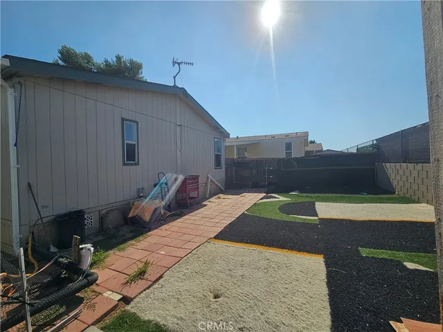 a view of a backyard of the house