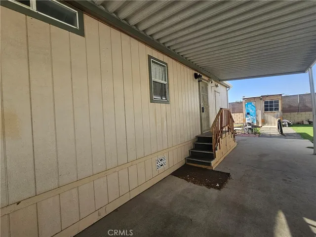 a view of a garage with wooden table and stairs