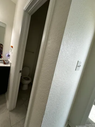 a bathroom with a double vanity sink toilet and shower
