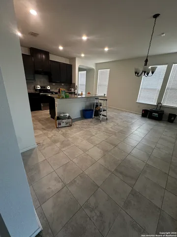 a room with furniture and a flat screen tv