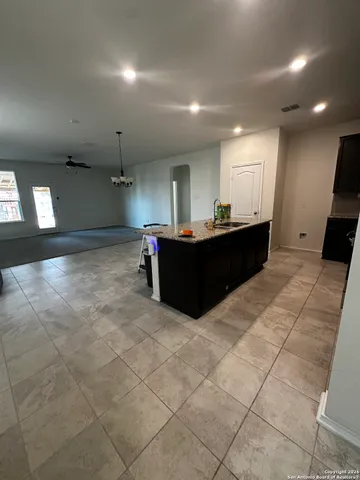 a view of an empty room and a window
