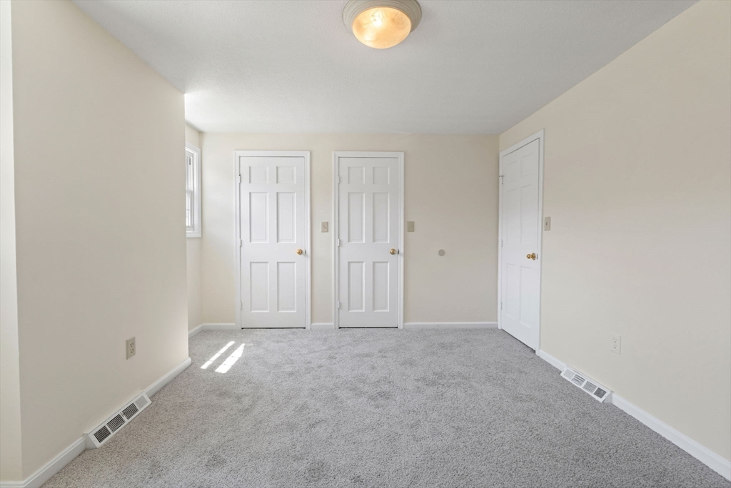 23 Constitution Way, Unit 23 Methuen, MA 01844 - Photo 12 of 21 an empty room with closet area