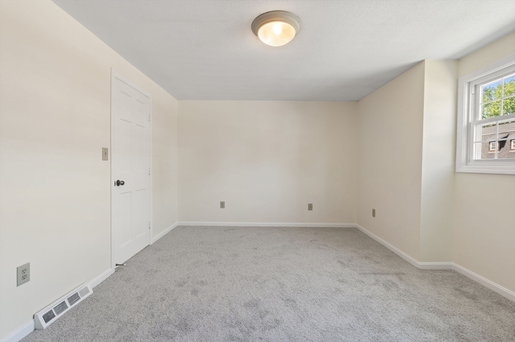23 Constitution Way, Unit 23 Methuen, MA 01844 - Photo 15 of 21 an empty room with windows