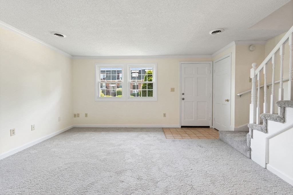 23 Constitution Way, Unit 23 Methuen, MA 01844 - Photo 18 of 21 a view of an empty room with a window
