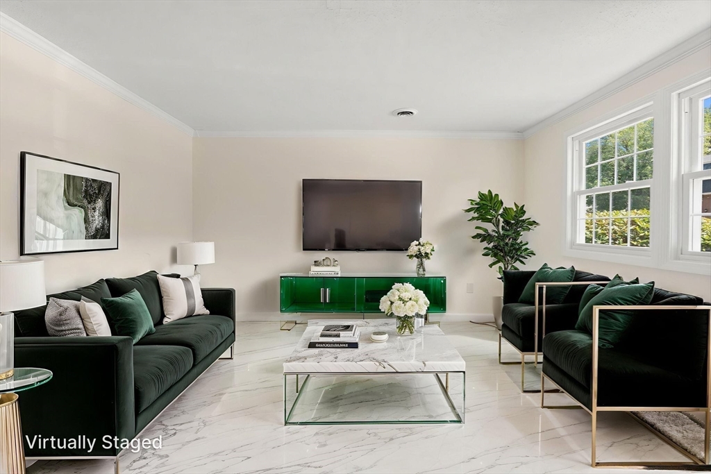 23 Constitution Way, Unit 23 Methuen, MA 01844 - Photo 20 of 21 a living room with furniture a large window and a flat screen tv