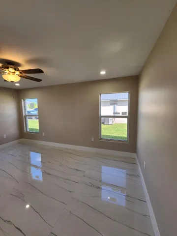 a view of an empty room and window
