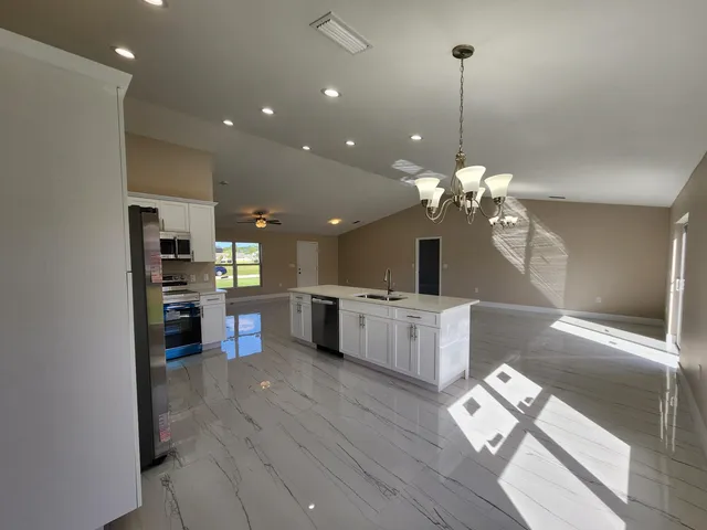 a view of a kitchen and dining room
