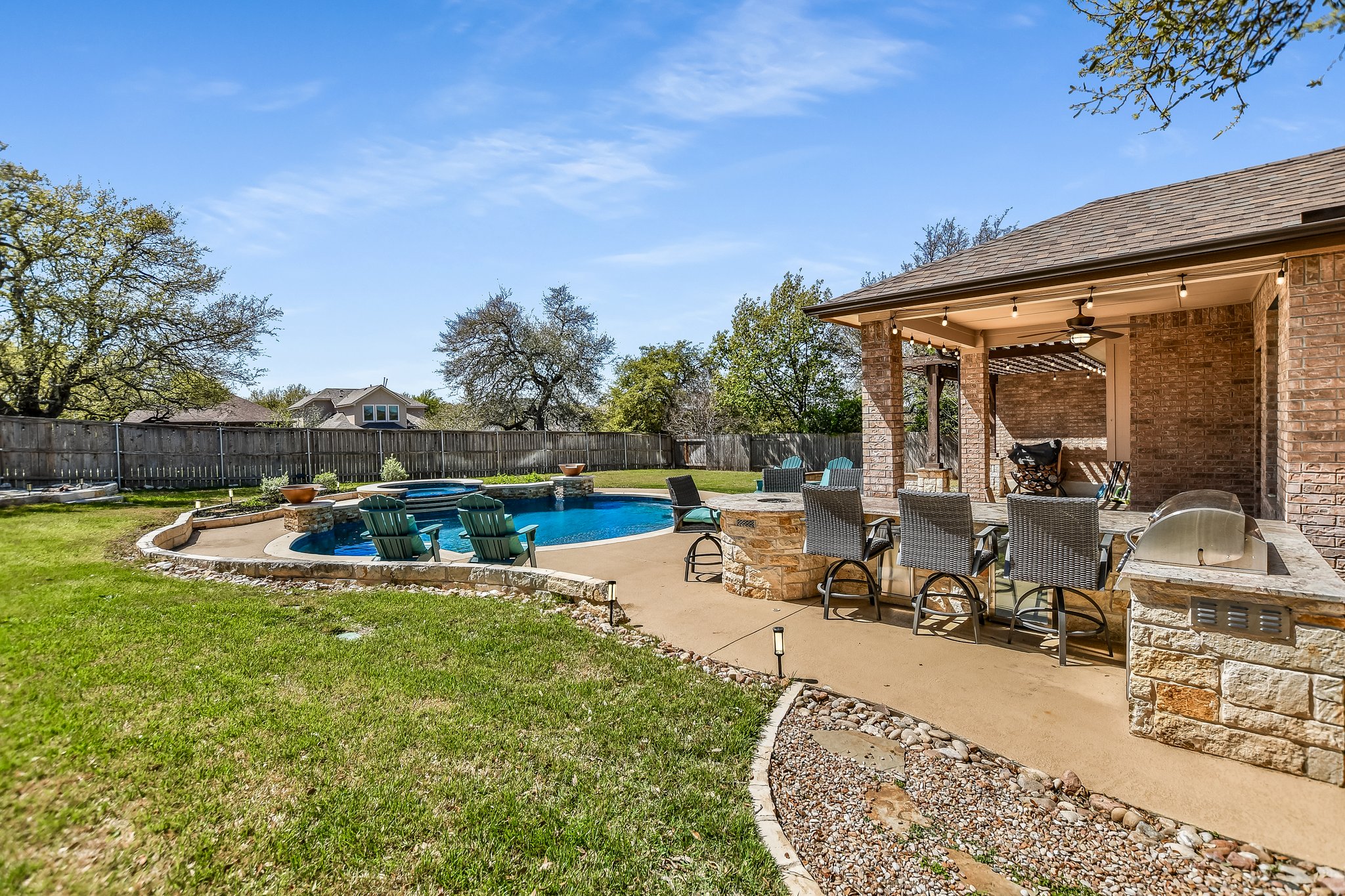 2037 Tribal Way Leander, TX 78641 - Photo 2 of 14 This view shows built in-grill and the built-in bar with a small built-in firepit
