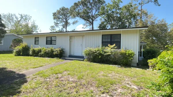 front view of a house with a yard