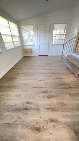 a view of an empty room with a window