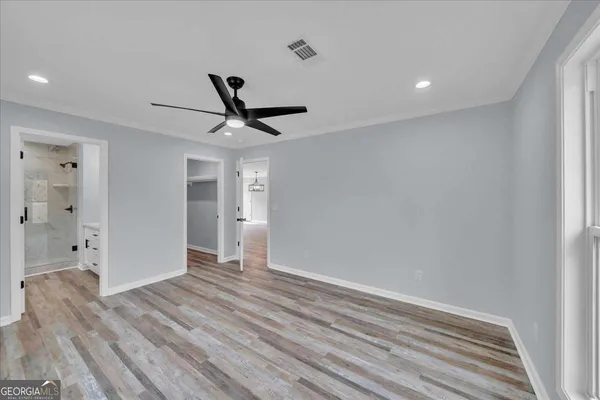 a bathroom with a double vanity sink and mirror
