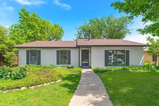 a front view of a house with a yard and porch