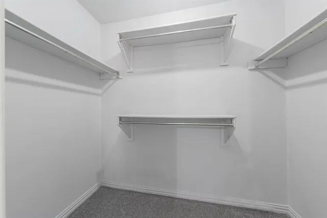 a view of an empty walk in closet