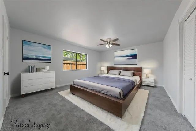 a spacious bedroom with a bed and a couch