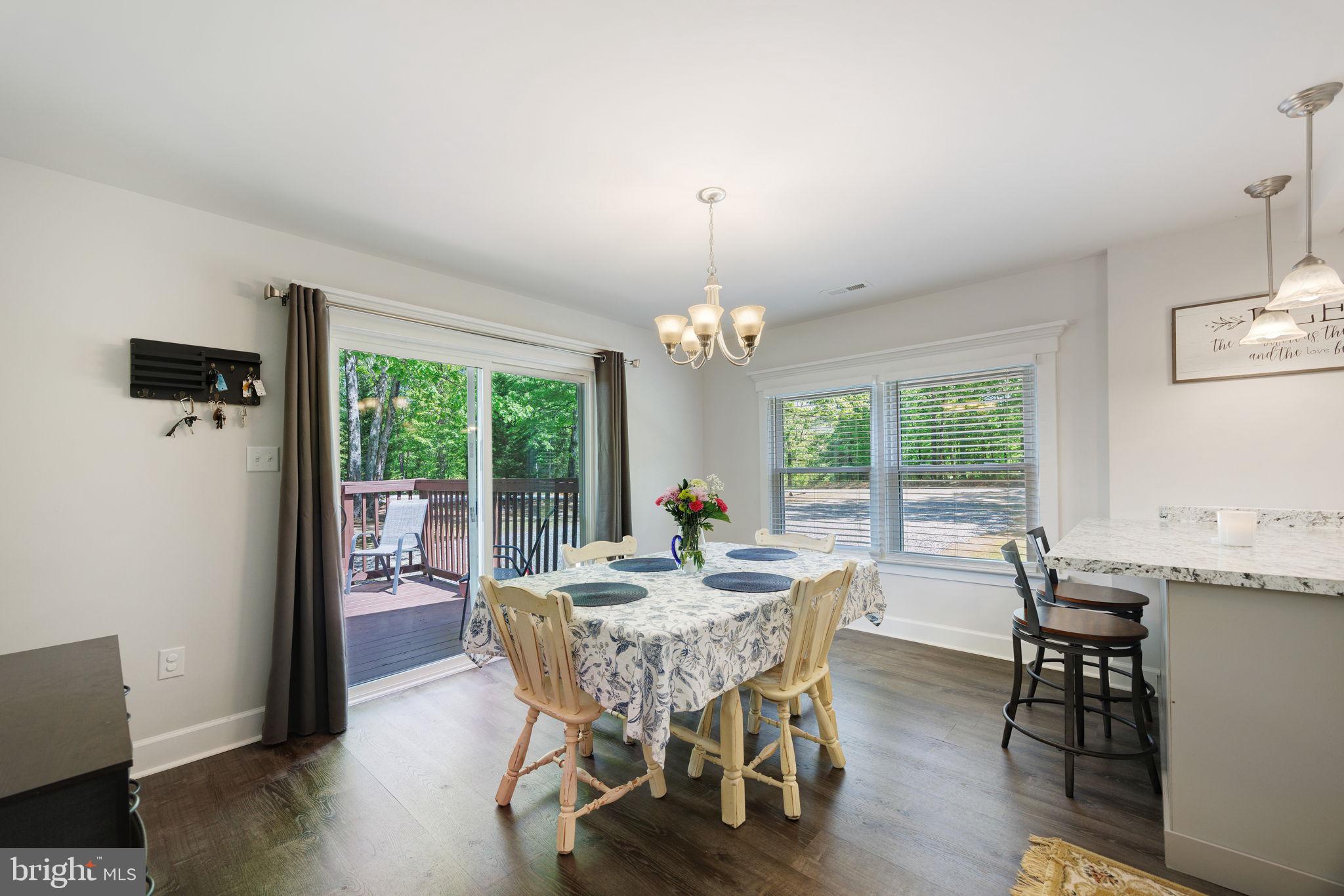 919 Chalklevel Road Louisa, VA 23093 - Photo 14 of 32 a view of a dining room with furniture window and wooden floor