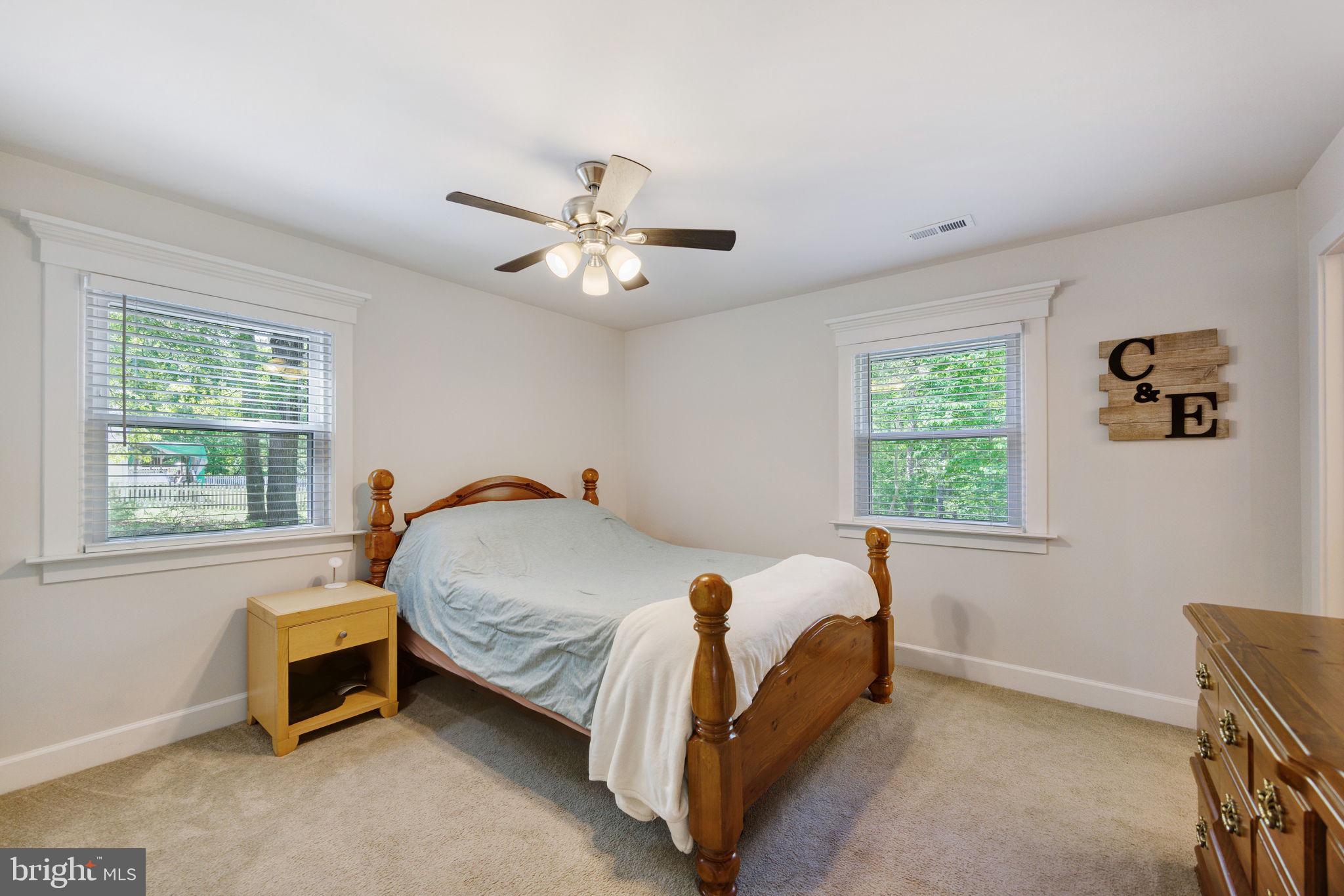 919 Chalklevel Road Louisa, VA 23093 - Photo 15 of 32 a bed sitting in a bedroom next to a window
