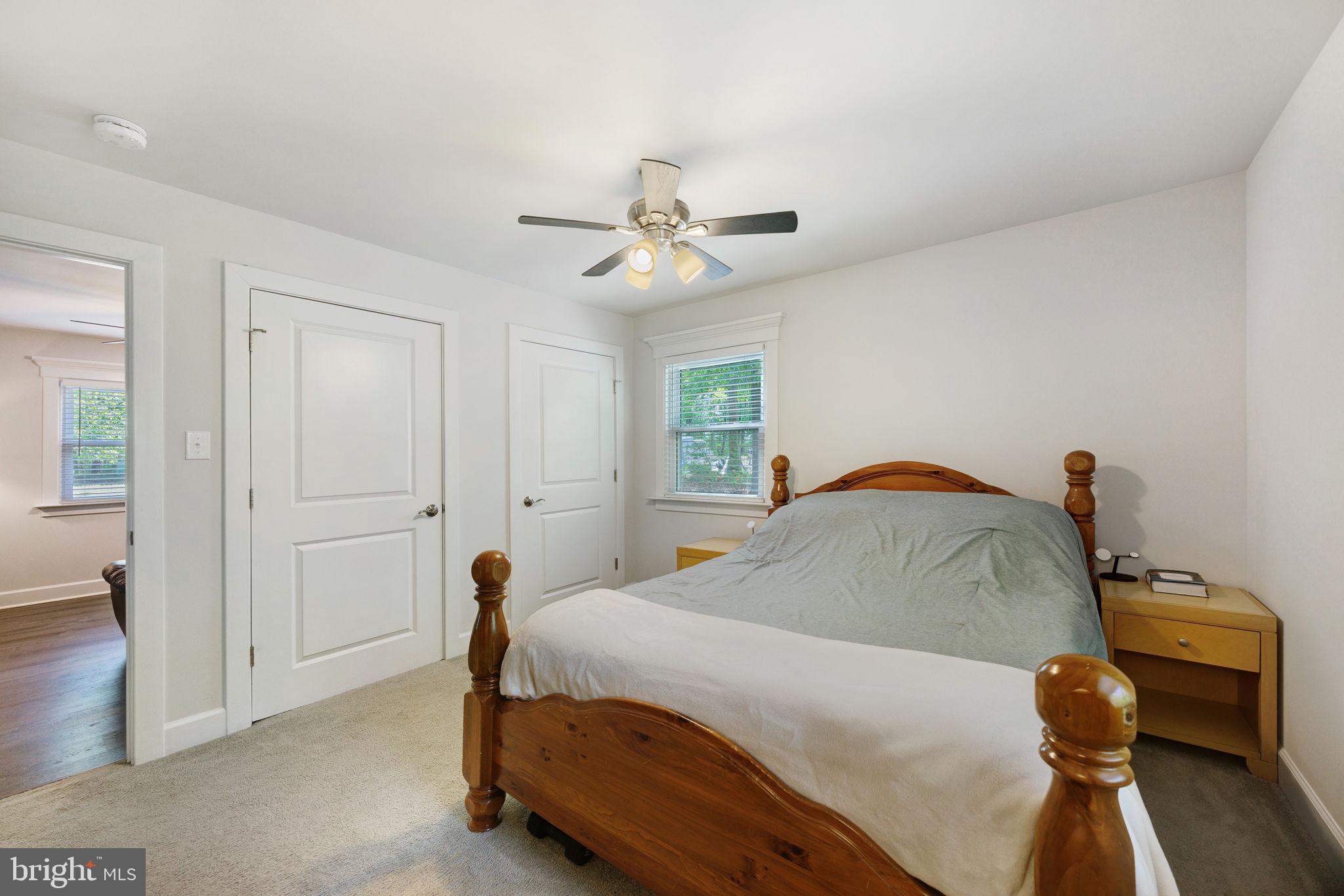 919 Chalklevel Road Louisa, VA 23093 - Photo 17 of 32 a bedroom with a bed and a chandelier