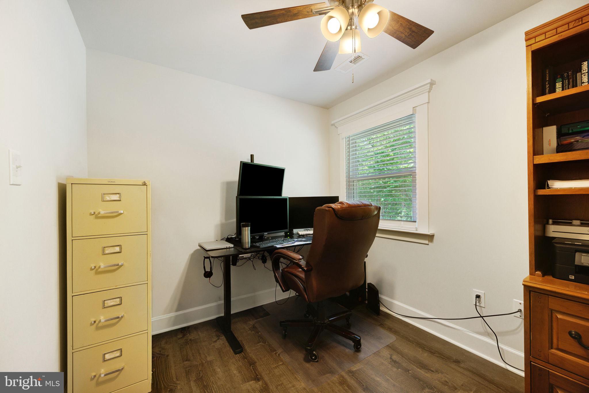 919 Chalklevel Road Louisa, VA 23093 - Photo 21 of 32 a view of a workspace with furniture and a window