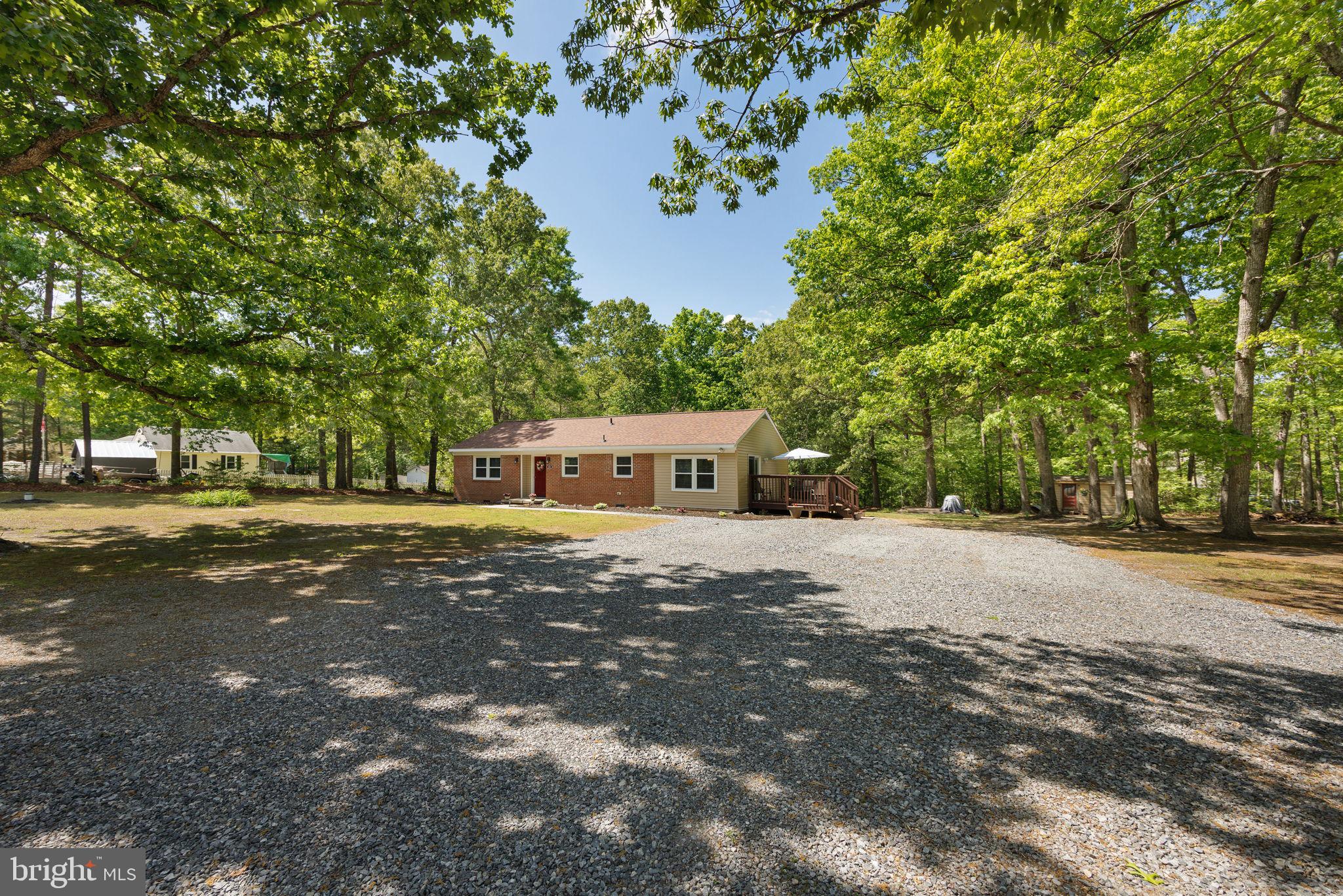 919 Chalklevel Road Louisa, VA 23093 - Photo 31 of 32 a front view of a house with a yard and trees