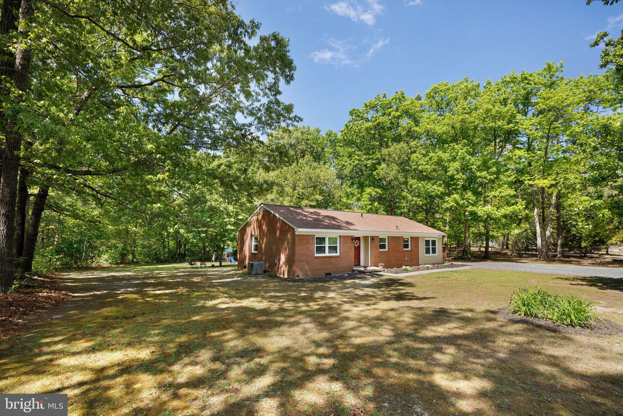 919 Chalklevel Road Louisa, VA 23093 - Photo 5 of 32 a front view of a house with a garden
