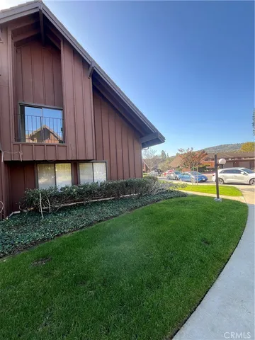 a view of a backyard with plants and a patio
