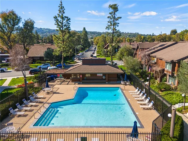 a view of a swimming pool with a lounge chairs