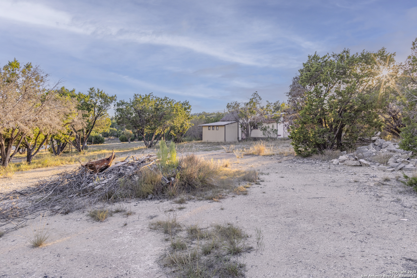 Tbd Rocky Ranch Canyon Lake, TX 78133 - Photo 7 of 18 a view of a dry yard with trees in the background