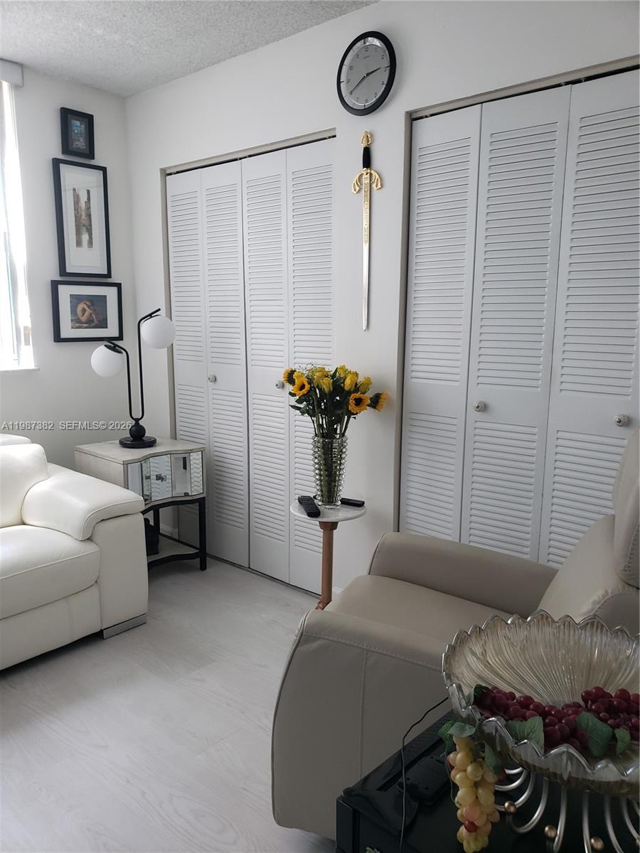 11800 Southwest 18th Street, Unit 3274 Miami, FL 33175 - Photo 11 of 23 a bedroom with a bed and a chandelier