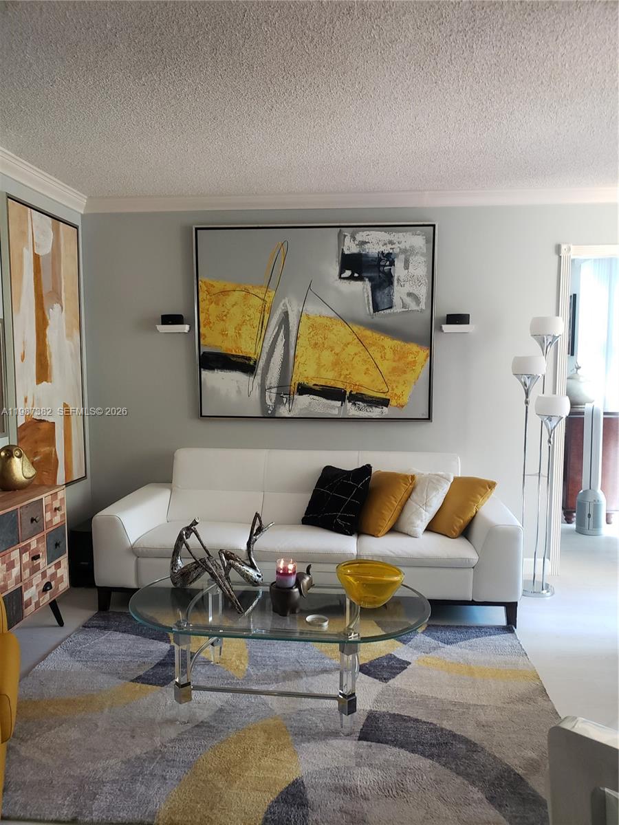 11800 Southwest 18th Street, Unit 3274 Miami, FL 33175 - Photo 12 of 23 a living room with furniture and a flat screen tv