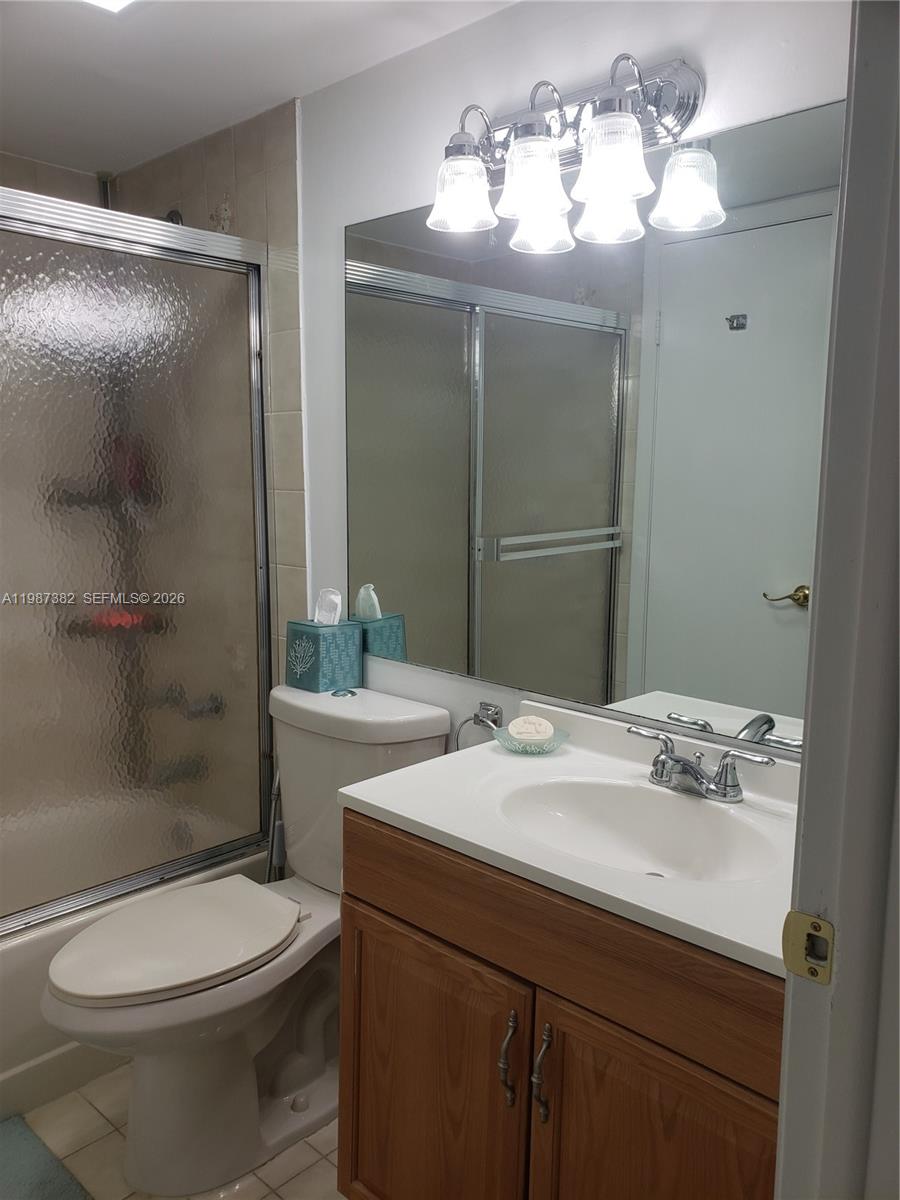 11800 Southwest 18th Street, Unit 3274 Miami, FL 33175 - Photo 16 of 23 a bathroom with a sink a toilet and shower