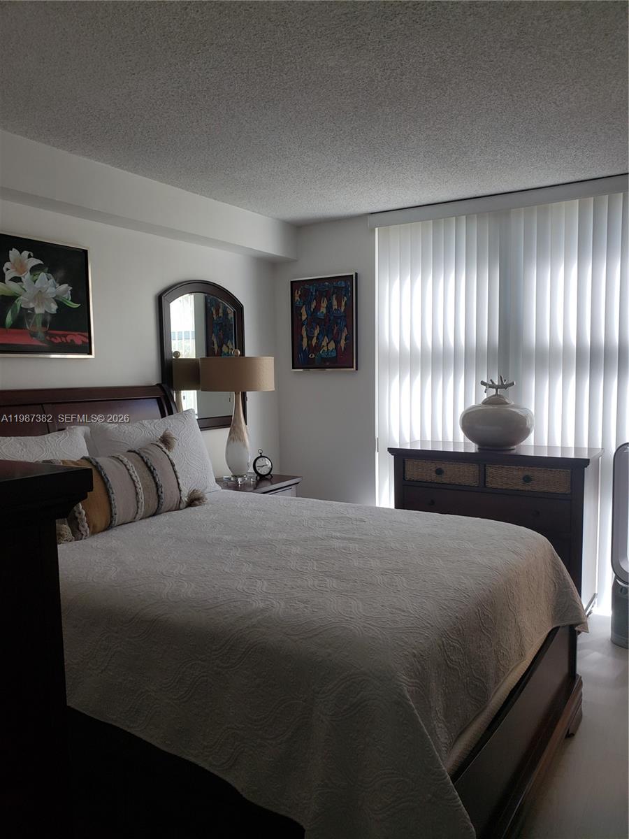 11800 Southwest 18th Street, Unit 3274 Miami, FL 33175 - Photo 20 of 23 a bedroom with a bed and window