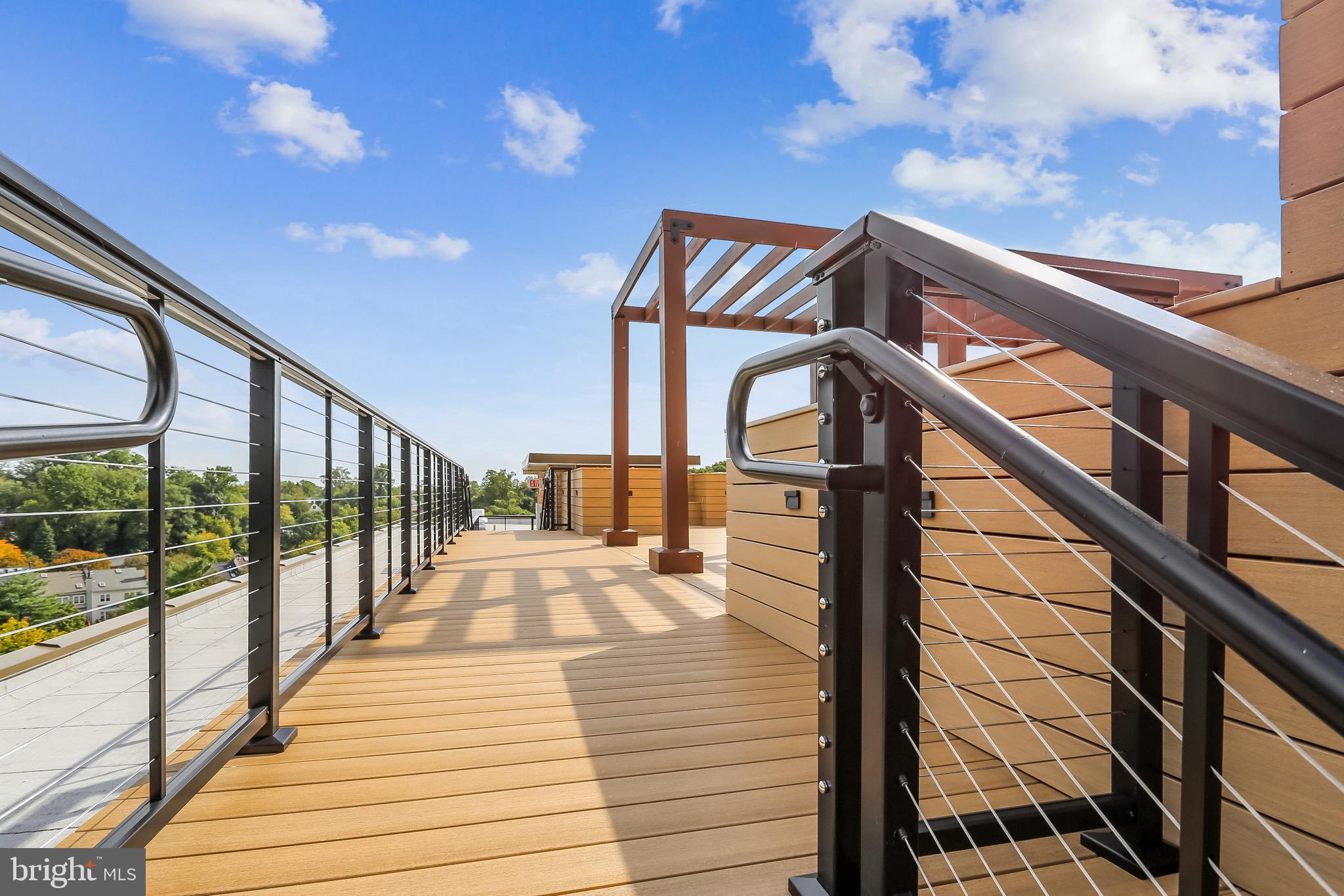 1900 Lyttonsville Road, Unit 802 Silver Spring, MD 20910 - Photo 14 of 38 a view of balcony with wooden floor