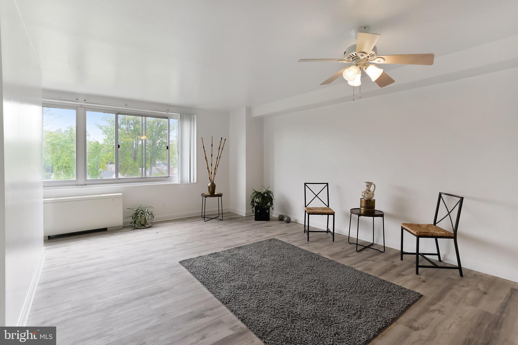 1900 Lyttonsville Road, Unit 802 Silver Spring, MD 20910 - Photo 22 of 38 a view of a livingroom with furniture window and wooden floor