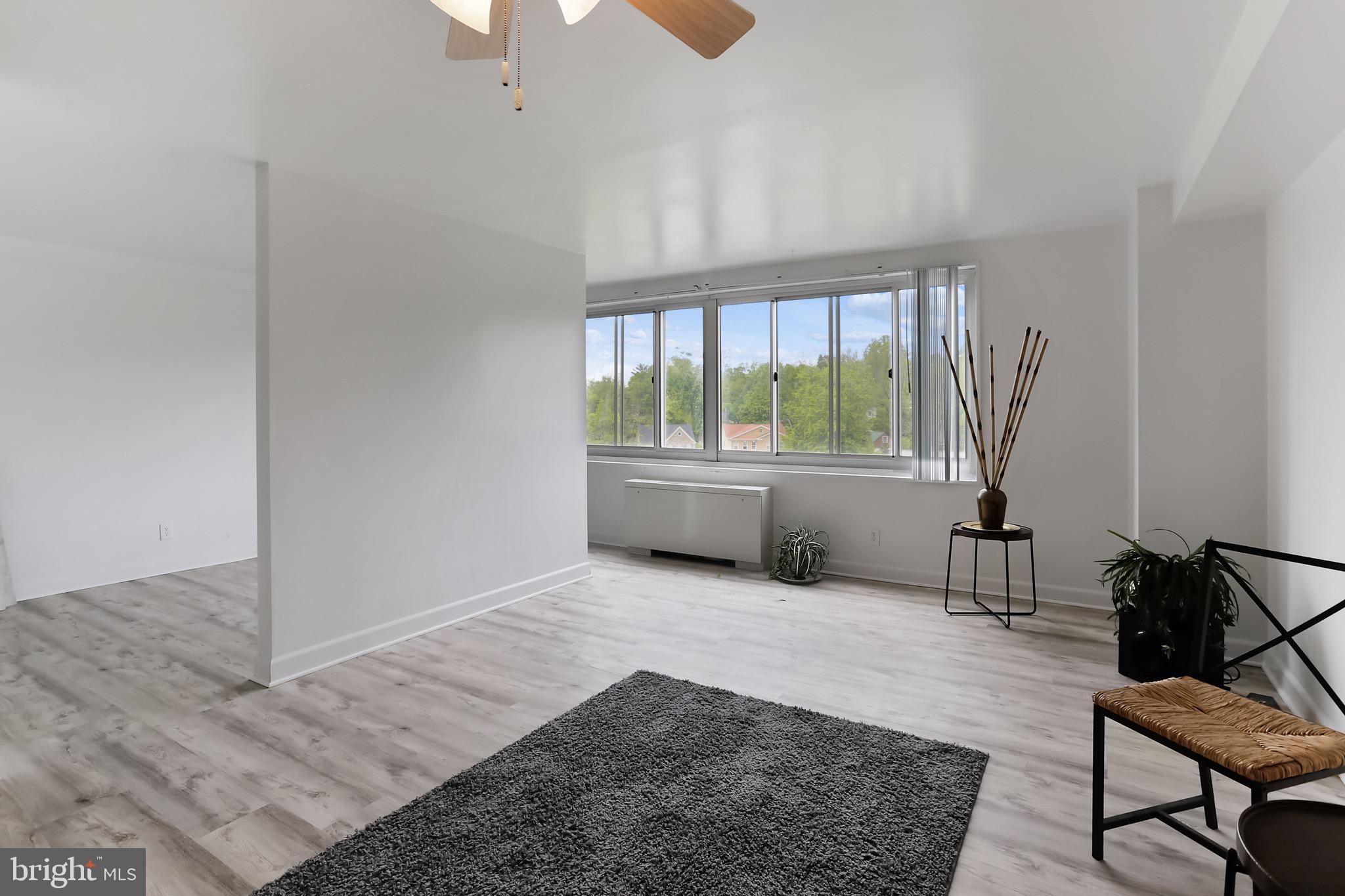 1900 Lyttonsville Road, Unit 802 Silver Spring, MD 20910 - Photo 23 of 38 a living room with furniture and a window