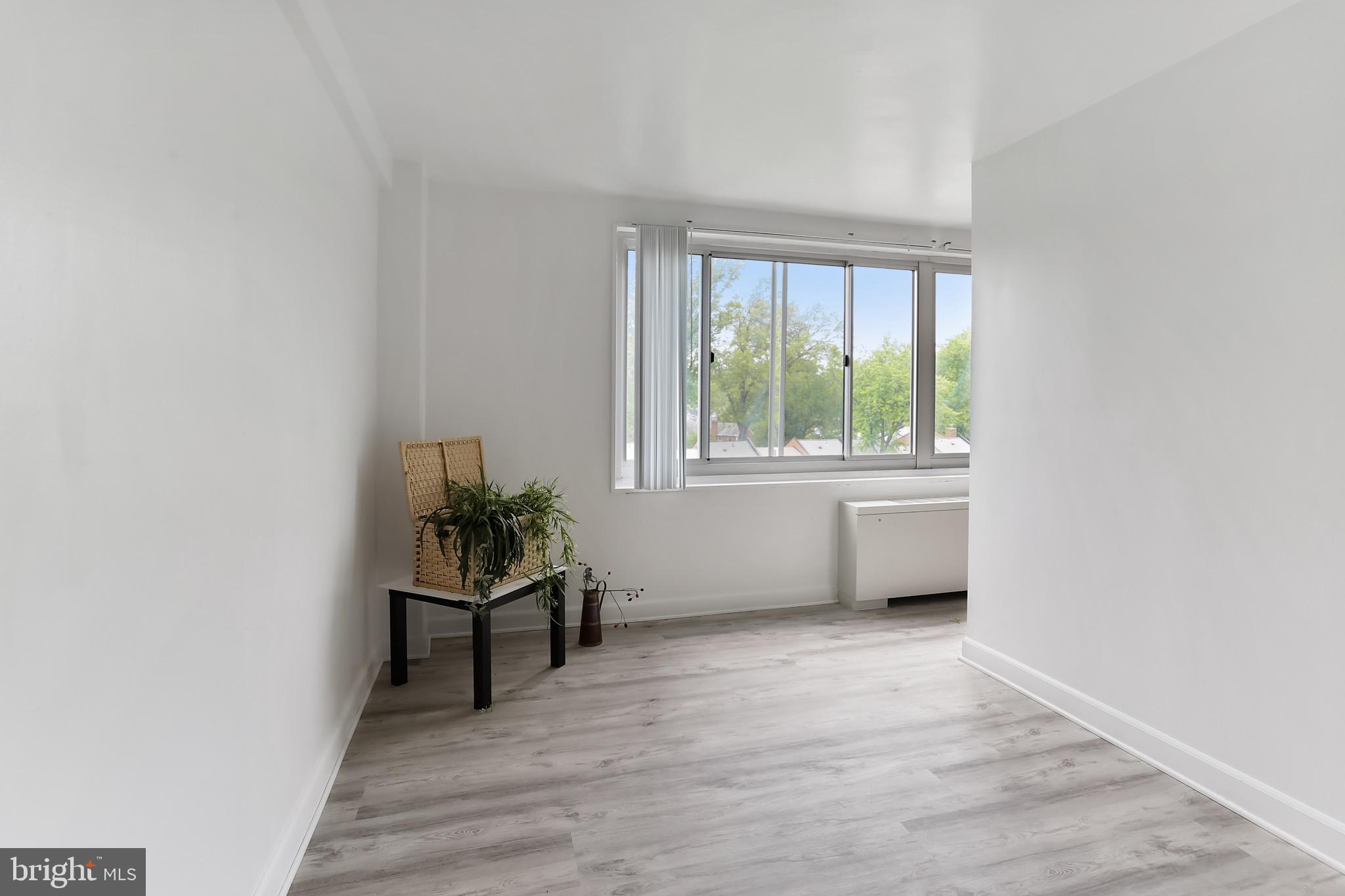 1900 Lyttonsville Road, Unit 802 Silver Spring, MD 20910 - Photo 25 of 38 a view of an empty room with a window