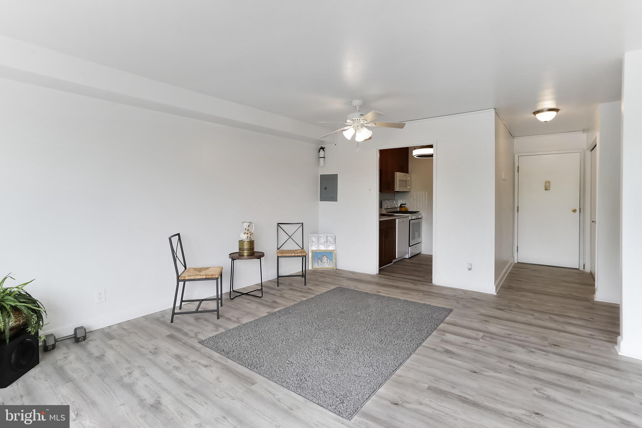 1900 Lyttonsville Road, Unit 802 Silver Spring, MD 20910 - Photo 27 of 38 a view of livingroom with furniture and wooden floor
