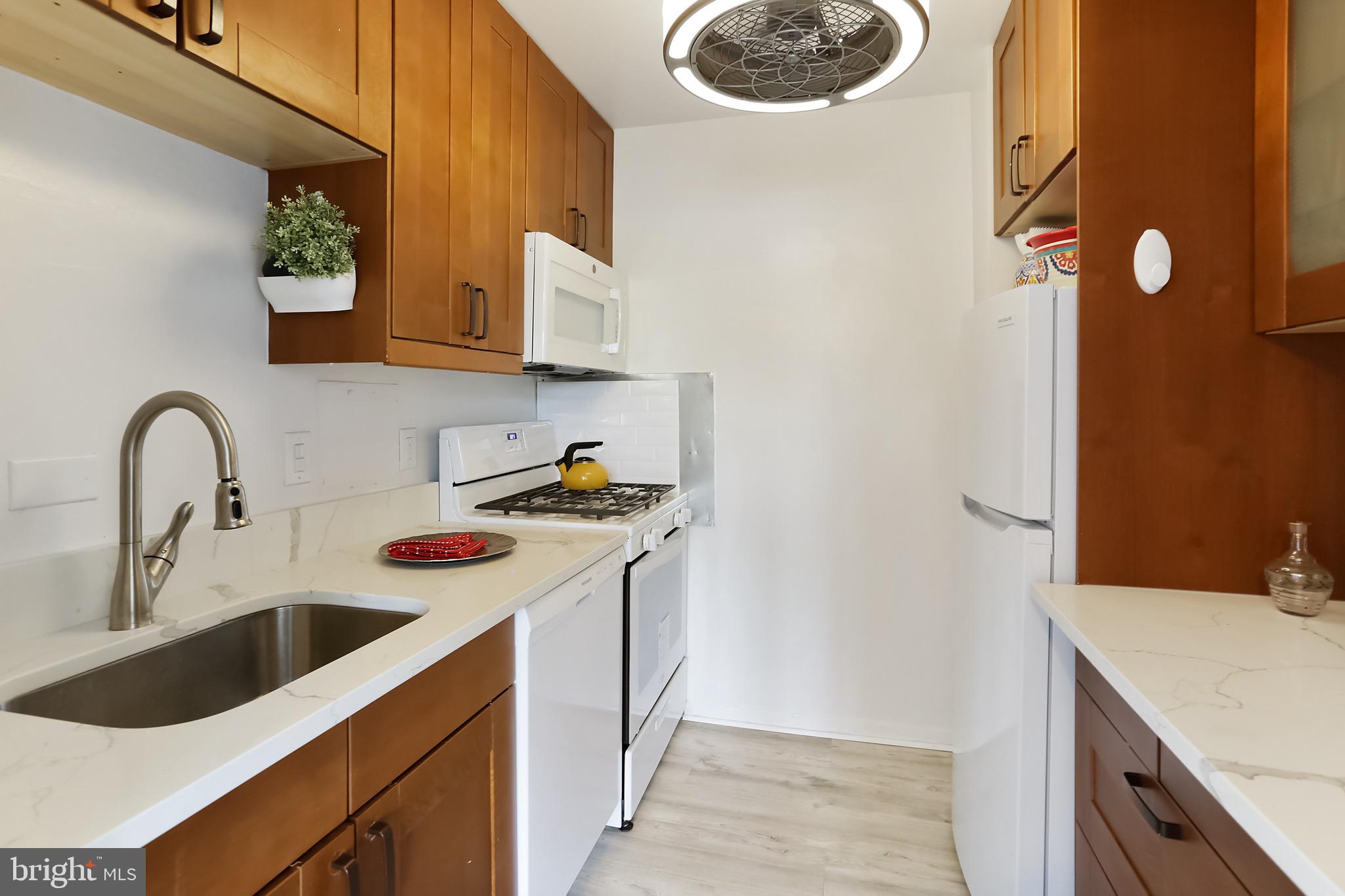 1900 Lyttonsville Road, Unit 802 Silver Spring, MD 20910 - Photo 31 of 38 a view of a kitchen with sink and dishwasher