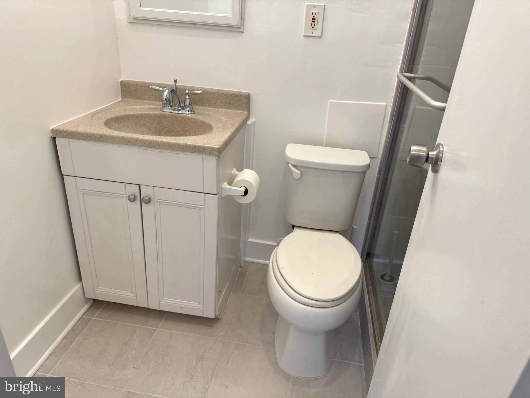 1900 Lyttonsville Road, Unit 802 Silver Spring, MD 20910 - Photo 35 of 38 a white toilet sitting next to a bathroom sink