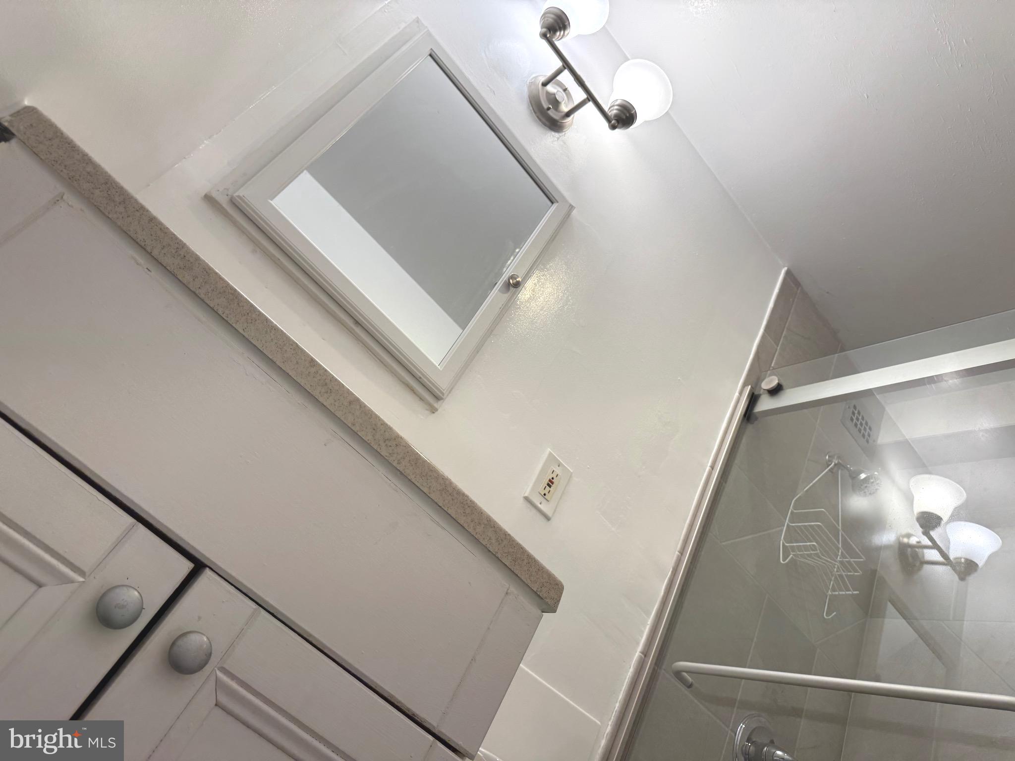 1900 Lyttonsville Road, Unit 802 Silver Spring, MD 20910 - Photo 36 of 38 a view of a room with wooden floor and staircase