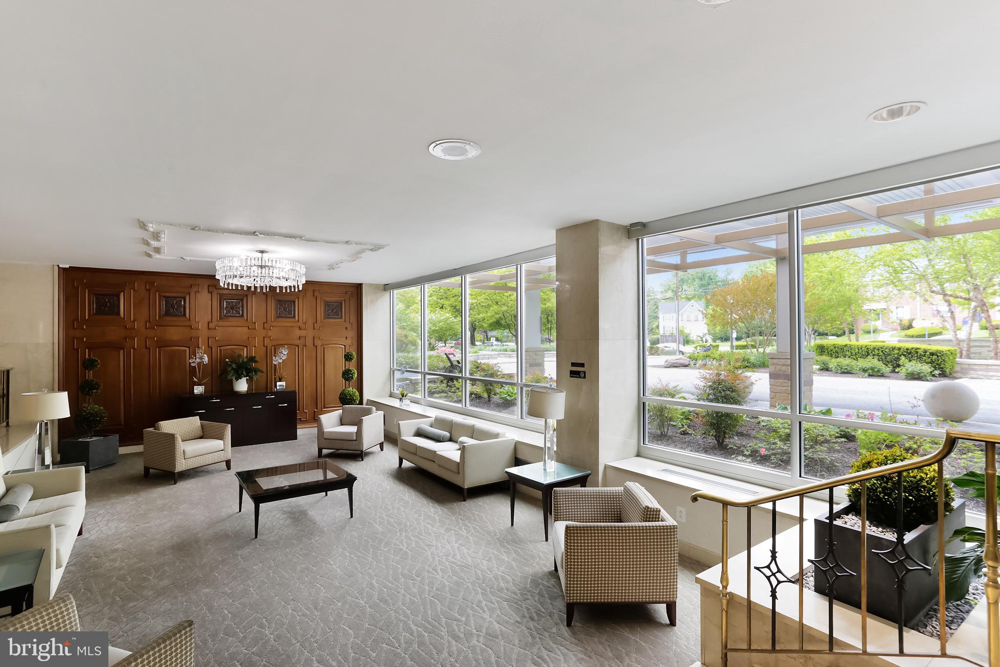 1900 Lyttonsville Road, Unit 802 Silver Spring, MD 20910 - Photo 7 of 38 a living room with furniture and a large window
