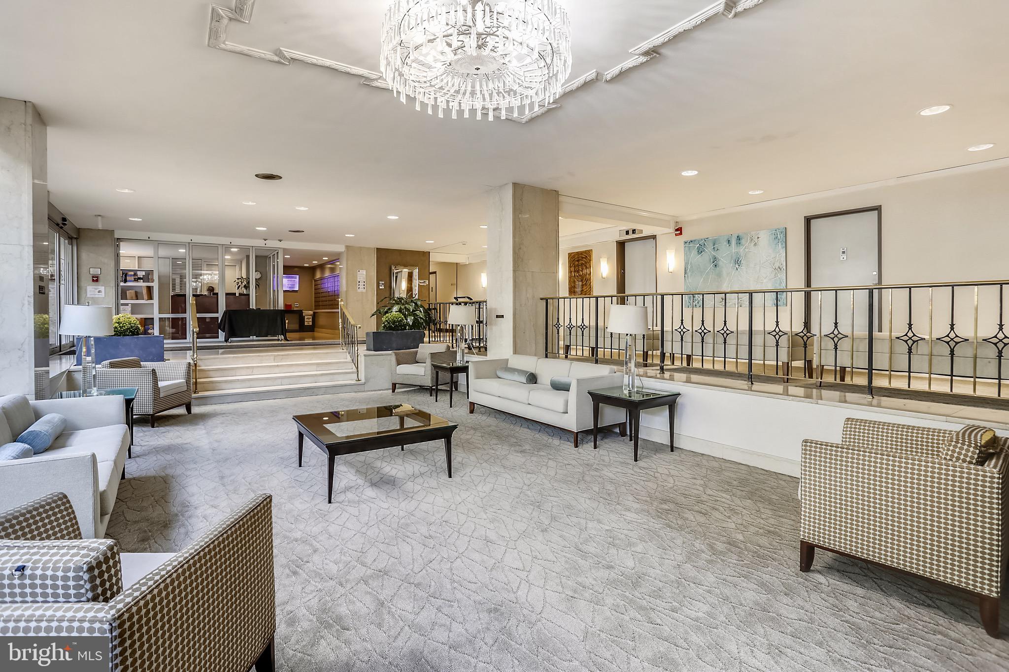 1900 Lyttonsville Road, Unit 802 Silver Spring, MD 20910 - Photo 8 of 38 a living room with furniture and a table