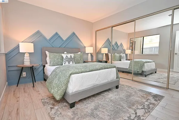a bed room with a bed and a couch