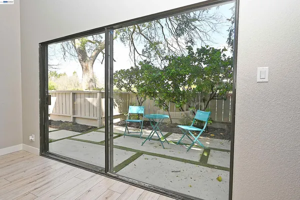 a view of living room with furniture and garden view