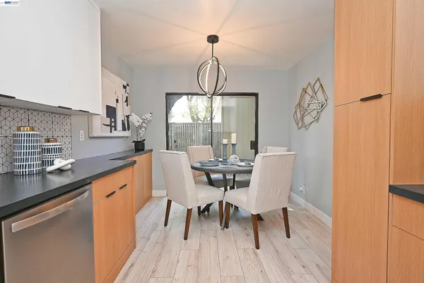 a view of a dining room with furniture window and outside view