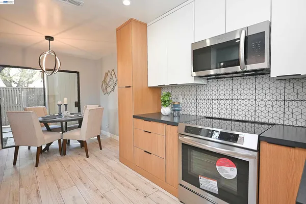 a kitchen with a stove and a microwave