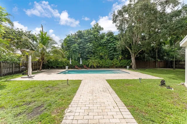 a view of a swimming pool with a patio