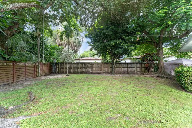 a view of a backyard with a trees